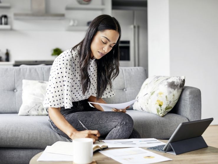 Woman working on laptop on a coffee table