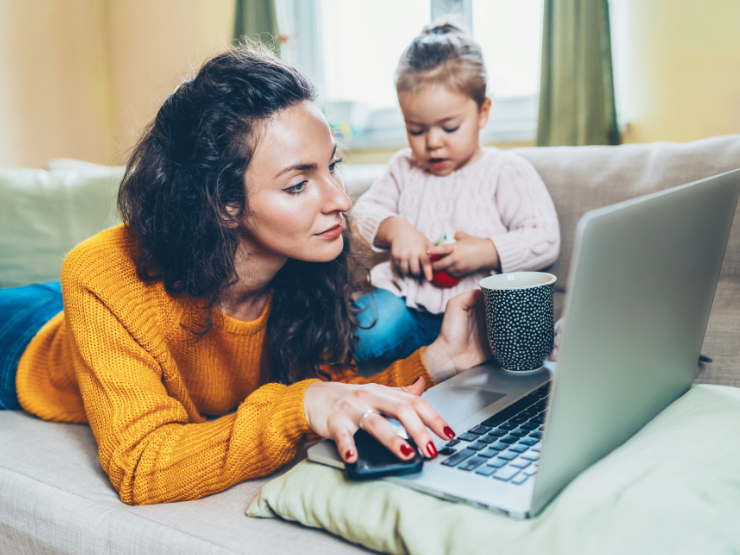 A mother and child as she's working from home