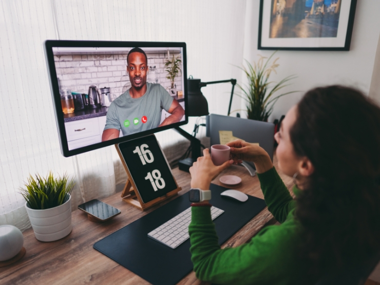 Woman looking at a monitor having a call