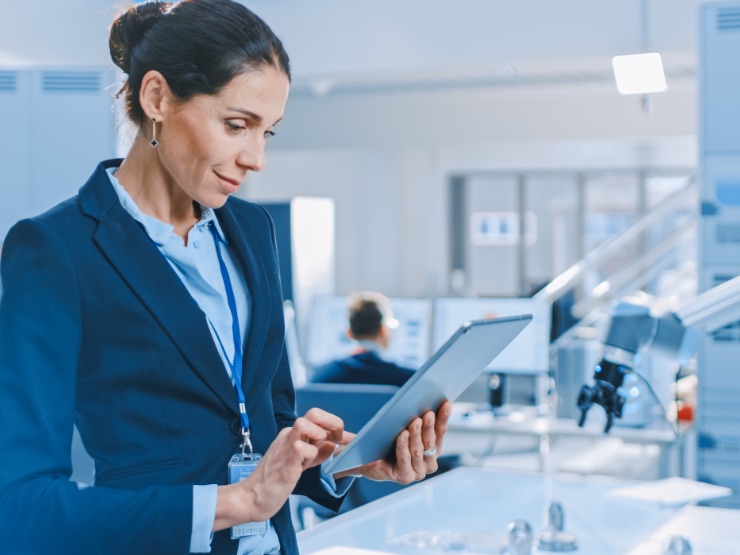 Business professional holding a laptop