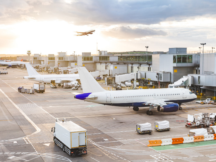 Passenger jet parked at airport gate