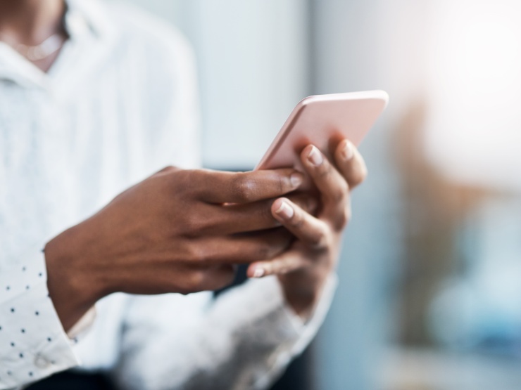 A woman holding her mobile phone