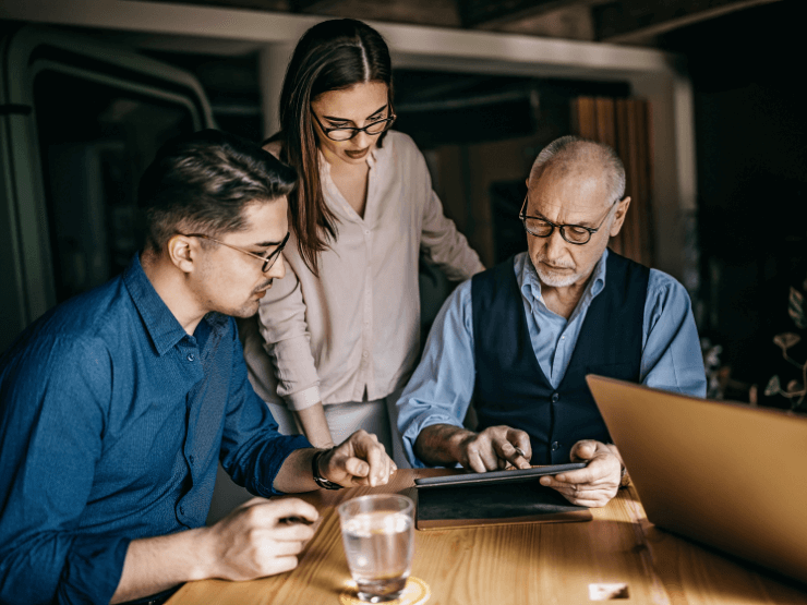 Three people collaborating 