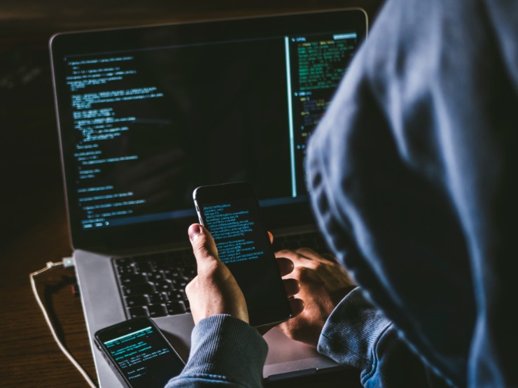 A hacker working on a computer