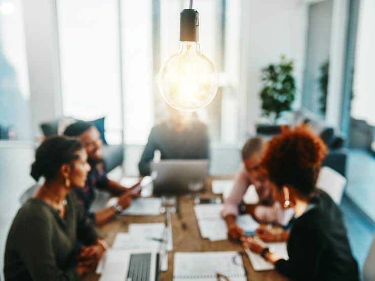A group of people sitting around a table