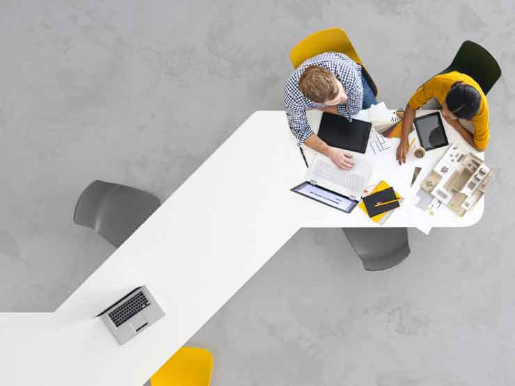 Aerial view of two people at a desk